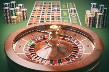 Casino roulette wheel with casino chips on green table. Gambling background. 3d illustration