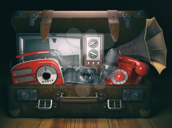 Vintage suitcase with old obsolete electronic equipment set. Retro technology concept background. Radio, tv set, telephone camera microphone and gramophone. 3d illustration