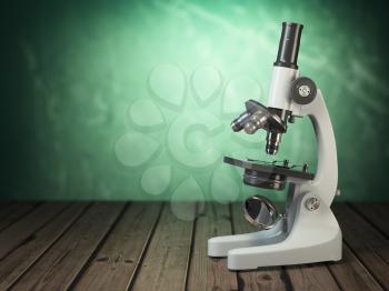 Microscope on wooden table and green vintage background. 3d illustration