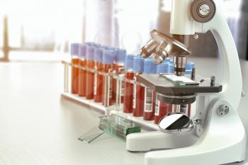 Microscope medical test tubes with blood samples in laboratory, 3d illustration