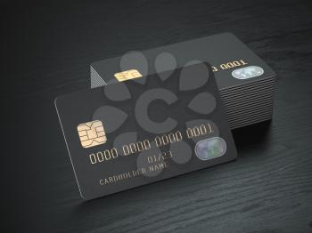 Stack of black blank credit cards mockup on black wood table background. 3d illustration
