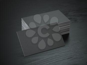 Stack of black blank business cards mockup on black wood table background, 3d illustration