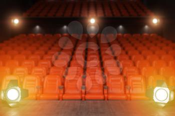 View from the stage of concert hall or theater with red seats and spot light. 3d illustration