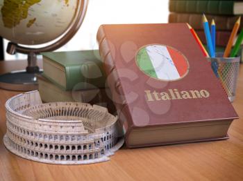 Studying and learn Italian concept. Book with flag of Italy and Coliseum on the table. 3d Iluustration