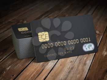 Stack of black blank credit cards mockup on  wooden table background. 3d illustration