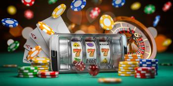 Online casino. Smartphone or mobile phone, slot machine, dice, cards and roulette on a green table in casino. 3d illustration