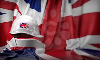 White hard hat laying over UK  flag. Construction and employment in United  Kingdom UK concept, Labor day. 3d illustration