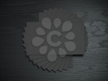 Black blank business cards mockup template on the black wooden table. 3d illustration