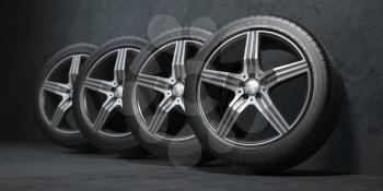 Car wheels. Four new black tyres with alloy discs in garage. 3d illustration