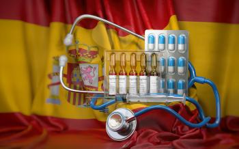 Healthcare, insurance and pharmacy in Spaim concept. Pills, vaccine, syrringe and stethoscope in spanish flag. 3d illustration