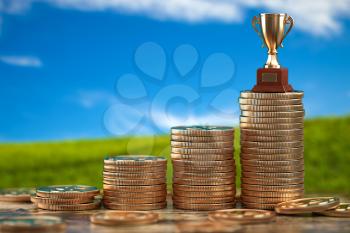 Trophy cup on stacks of coin.   Concept of success, growing business and profit. 3d illustration