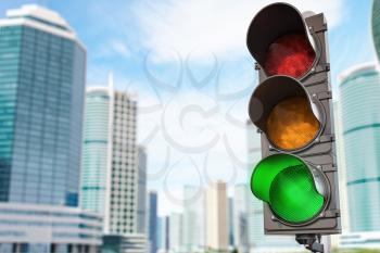 Traffic light with green light on urban skyscrapers city background. 3d illustration
