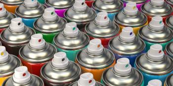 Rows of colorful graffity spray paint cans or bottles of aerosol. 3d illustration
