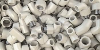 Various fittings of pvc plastic pipes and tubes in heap. Plumbing ackground. 3d illustration