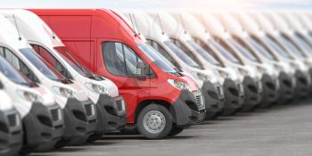 Red delivery van in a row of white vans. Best express delivery and shipemt service concept. 3d illustration