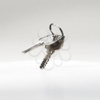 Two silver metal keys on a ring, falling on the floor. Don't loose your keys. Security of assets concept.