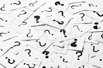 Pile of question mark signs scattered around as a square background. Decision, enquiry or faq concept.