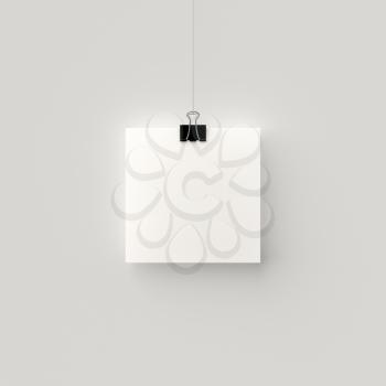 Poster hanging on a thread with a black clip. Blank square sheet of paper against a concrete wall mock up. Urban minimalistic style portfolio presentation concept.