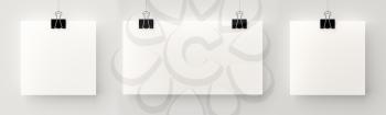 Set or three posters hanging in a row on a thread with black clips, blank mock up against grey wall. 3D illustration