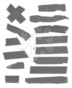 Big set of grey adhesive tape pieces isolated on white background