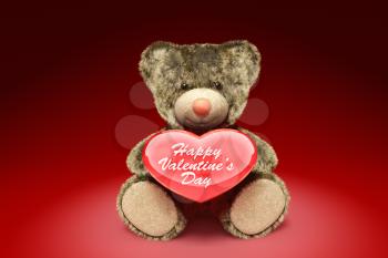 Cute fury teddy bear holding red heart. 3D illustration