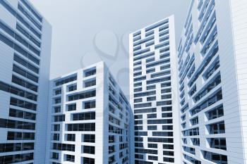 Abstract modern city architecture.Cityscape of tall skyscrapers towers over blue sky. 3d render illustration