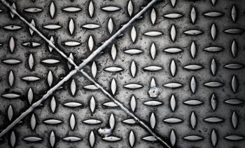 Closeup texture of diamond steel plate with perpendicular crossing joints