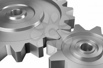 industrial and business processing and working concept: two steel interlocking cogwheels on downward diagonal over isolated white background