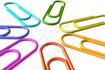 Colored paperclips laid out in the shape of a flower or a star closeup view isolated on white background