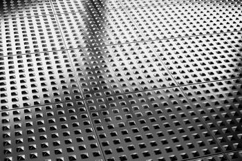 Abstract industrial creative metal construction monochrome illustration: industrial steel flooring metal surface closeup under bright lights, industrial 3d illustration