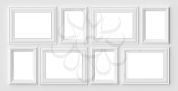 White blank photo or picture frames on the white wall with shadows with copy-space, white colorless picture frames template set, art frame mock-up 3D illustration