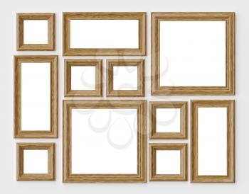 Wood blank photo or picture frames on white wall with shadows with copy-space, decorative wooden picture frames template set, art frame mock-up 3D illustration