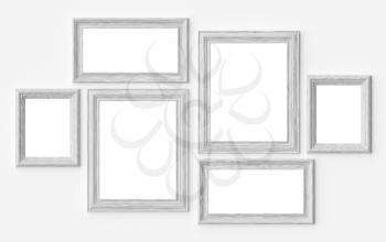 White wooden blank picture or photo frames on white wall with shadows with copy-space, decorative wooden picture frames template set, art frame mock-up 3D illustration