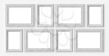 White wooden blank frames for picture or photo on white wall with shadows with copy-space, decorative wooden picture frames template set, art frame mock-up 3D illustration