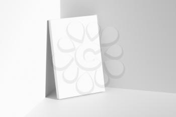 Blank white empty rectangular poster on floor leaning at empty white walls in cornet diagonal top view, white bleached colorless poster mock-up, 3D Illustration