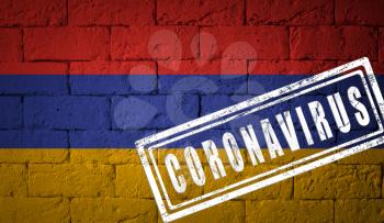 Flag of the Armenia with original proportions. stamped of Coronavirus. brick wall texture. Corona virus concept. On the verge of a COVID-19 or 2019-nCoV Pandemic.