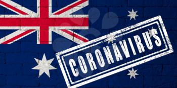 Flag of the Australia with original proportions. stamped of Coronavirus. brick wall texture. Corona virus concept. On the verge of a COVID-19 or 2019-nCoV Pandemic.