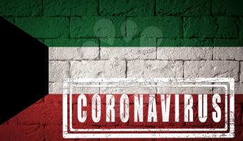 Flag of the Kuwait with original proportions. stamped of Coronavirus. brick wall texture. Corona virus concept. On the verge of a COVID-19 or 2019-nCoV Pandemic.