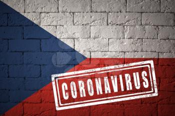 Flag of the Czech Republic with original proportions. stamped of Coronavirus. brick wall texture. Corona virus concept. On the verge of a COVID-19 or 2019-nCoV Pandemic.