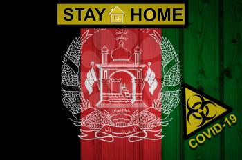 Grunge flag of the Afghanistan in original proportions. Quarantine and isolation - Stay at home. flag with biohazard symbol and inscription COVID-19.