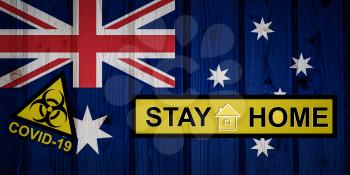 Flag of the Australia in original proportions. Quarantine and isolation - Stay at home. flag with biohazard symbol and inscription COVID-19.