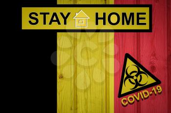Flag of the Belgium in original proportions. Quarantine and isolation - Stay at home. flag with biohazard symbol and inscription COVID-19.