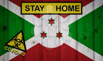 Flag of the Burundi in original proportions. Quarantine and isolation - Stay at home. flag with biohazard symbol and inscription COVID-19.