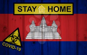 Flag of the Cambodia in original proportions. Quarantine and isolation - Stay at home. flag with biohazard symbol and inscription COVID-19.