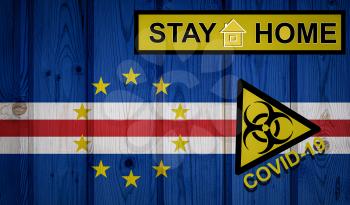 Flag of the Cape Verde in original proportions. Quarantine and isolation - Stay at home. flag with biohazard symbol and inscription COVID-19.
