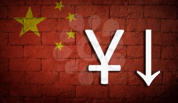 symbolic depreciation of the national currency Yuan against of the country flag China. The concept of the depreciation of the currency, the fall of the economy and the breakdown of economic ties