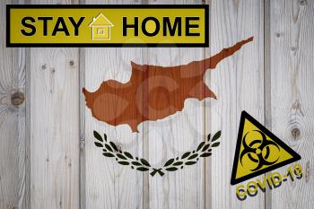 Flag of the Cyprus in original proportions. Quarantine and isolation - Stay at home. flag with biohazard symbol and inscription COVID-19.