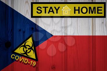 Flag of the Czech Republic in original proportions. Quarantine and isolation - Stay at home. flag with biohazard symbol and inscription COVID-19.