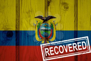 flag of Ecuador that survived or recovered from the infections of corona virus epidemic or coronavirus. Grunge flag with stamp Recovered