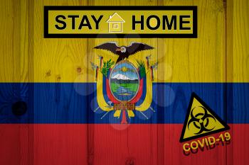 Flag of the Ecuador in original proportions. Quarantine and isolation - Stay at home. flag with biohazard symbol and inscription COVID-19.